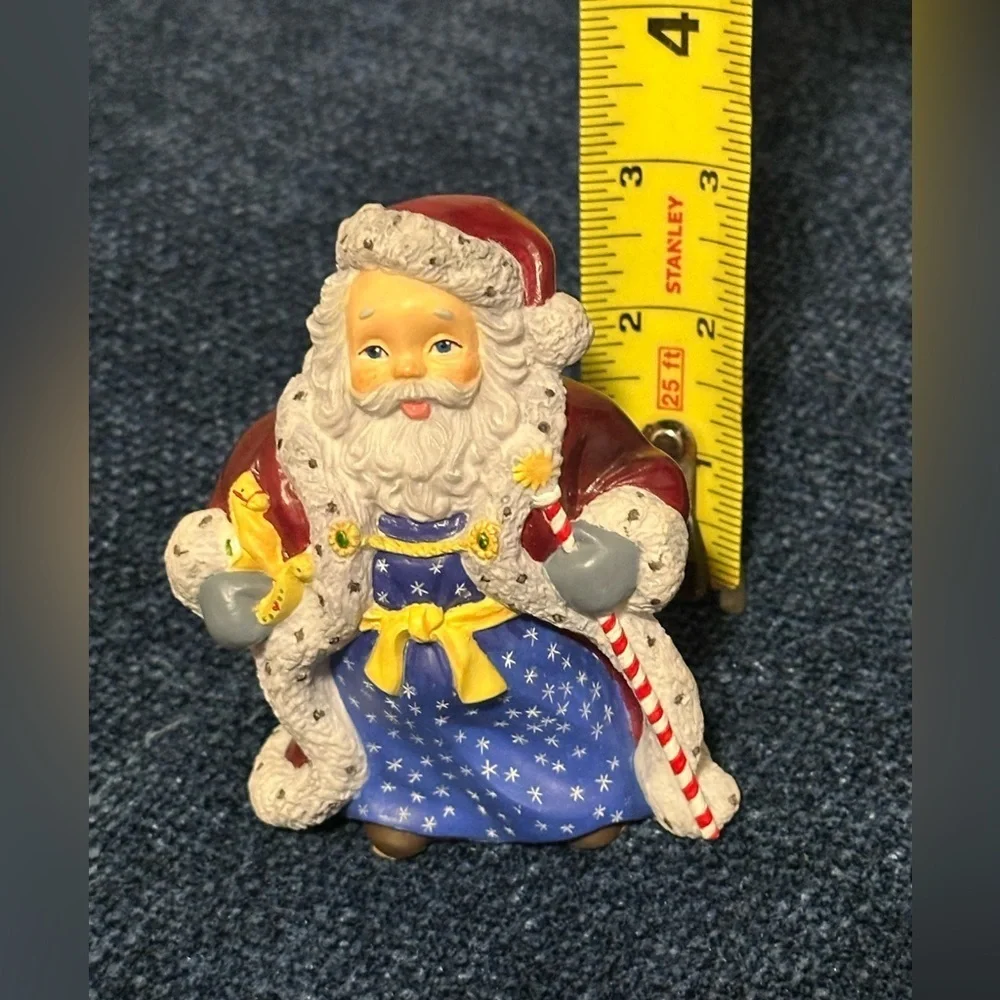 Small Santa with stars on his robe by Lenox’s Collectors Treasury of Santa’s.